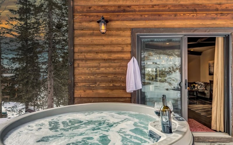 Dakota Sunset Lodge, hot tub at sunset with wine