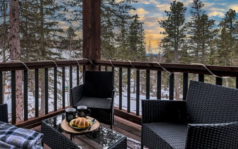 Dakota Sunset Lodge, deck with coffee and croissants at dusk
