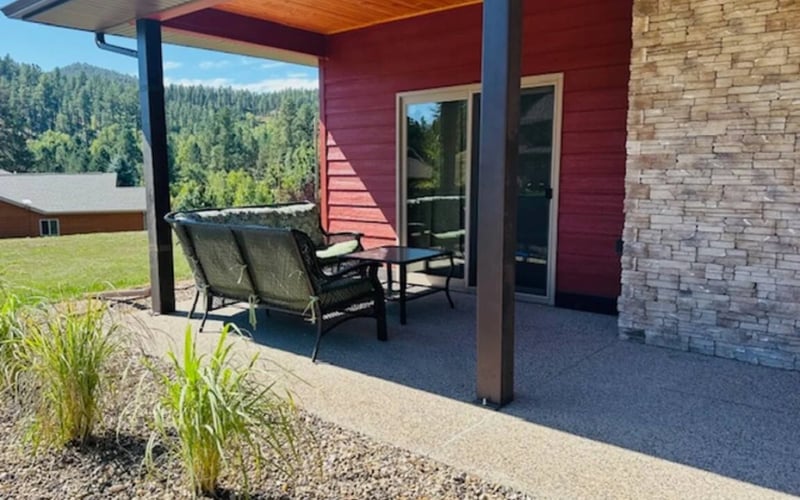 Granite Point, covered patio with forest views