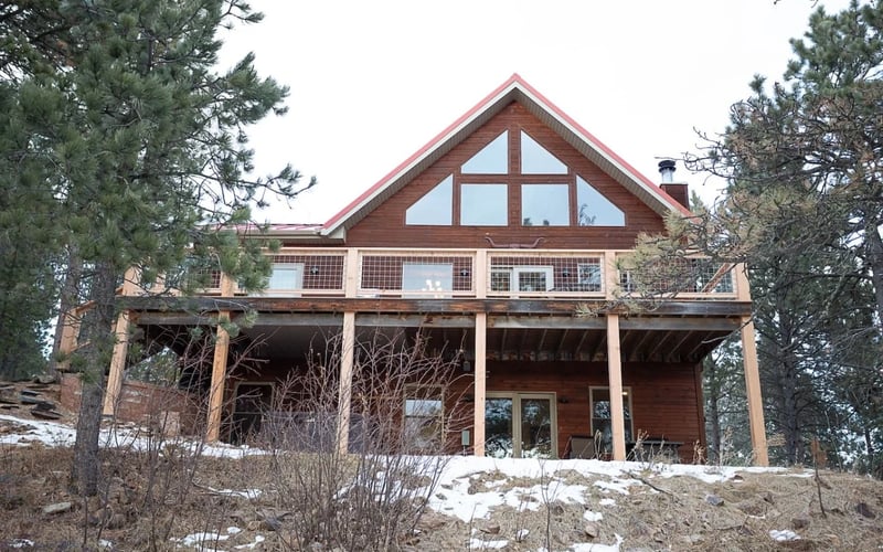 Royal Straight Cabin, rear view with large windows and deck
